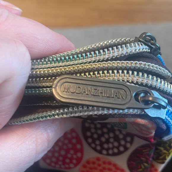 This cute little nylon wristlet with 3 zip pockets is NWOT’s - Picture 5 of 6